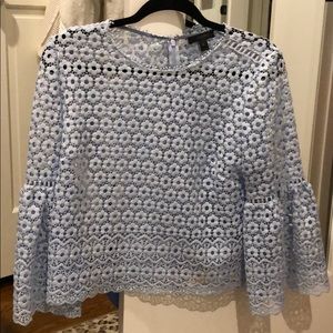 Blue blouse with floral cutouts